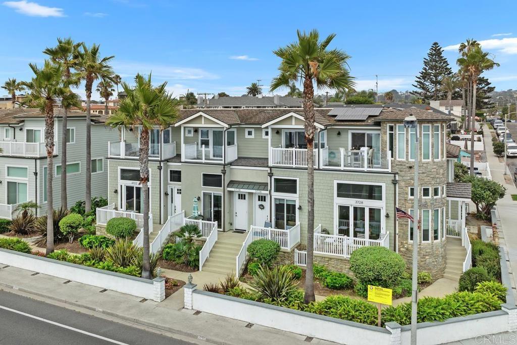 Experience oceanfront living—just steps from the beach and surf! This stylish, light-filled Carlsbad townhome offers spectacular ocean and sunset views, paired with a spacious, thoughtfully designed floor plan and high-end finishes throughout. On the main level, a generous living room with west-facing windows and a private patio overlooks the waves, while the dining area flows seamlessly into the remodeled gourmet kitchen, featuring custom marble countertops and tile work, white oak hardwood floors, and stainless-steel appliances—including a refrigerator. The home’s remodeled beach-chic décor carries throughout. Just half a mile away, Carlsbad Village awaits with its trendy cafés, restaurants, and boutique shopping. Upstairs, the private primary suite features jaw-dropping whitewater and sunset views (enjoyed from the bedroom and deck). The spa-inspired remodeled primary-bathroom boasts a dual vanity, custom marble finishes, soaking tub, and walk-in shower, plus there’s an additional 14’x14’ deck off the back of the home for even more outdoor living space. The second suite is equally inviting, with a beautifully remodeled bathroom. A versatile lower-level bonus room makes the ideal home office, gym, or game room. Additional upgrades include a full-size washer and dryer for convenience. Parking is effortless with an oversized finished 1-car garage, convenient reserved space (can fit more than 1 vehicle), and additional guest parking. For beach access, simply step outside, cross the nearby crosswalk, and you’re on the sand. Enjoy miles of manicured oceanfront coastal trails and park areas right at your doorstep. This is beach living at its best!