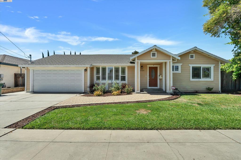 5 Bedroom, 3 Bath + Office – 2,420 Sq Ft | Modern single-story home with vaulted ceilings, huge dining area, updated kitchen with granite counters, stainless steel appliances, and stone backsplash | Laminate flooring throughout | Laundry room | Pass-through garage with rear roll-up door | Large private backyard with hardscape seating, lawn, and fruit trees (plum apricot, peach, grapefruit, mandarin orange) | Convenient location near highways and BART