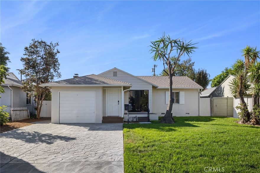 Set on a peaceful, tree-lined street in the heart of Sherman Oaks, this lovely 2-bedroom, 1-bath home is move-in ready. The bright and inviting interior features abundant natural light, newer flooring, and fresh paint inside and out. The updated bathroom adds a modern touch, while the bonus room with a cozy fireplace offers the perfect space for a den, office, or playroom. The kitchen includes stainless steel appliances and ample cabinetry. Enjoy the expansive grassy backyard complete with a patio and fruit trees, ideal for outdoor dining or relaxing. Conveniently located near great shopping, dining, and easy freeway access, this home offers the best of Sherman Oaks living.