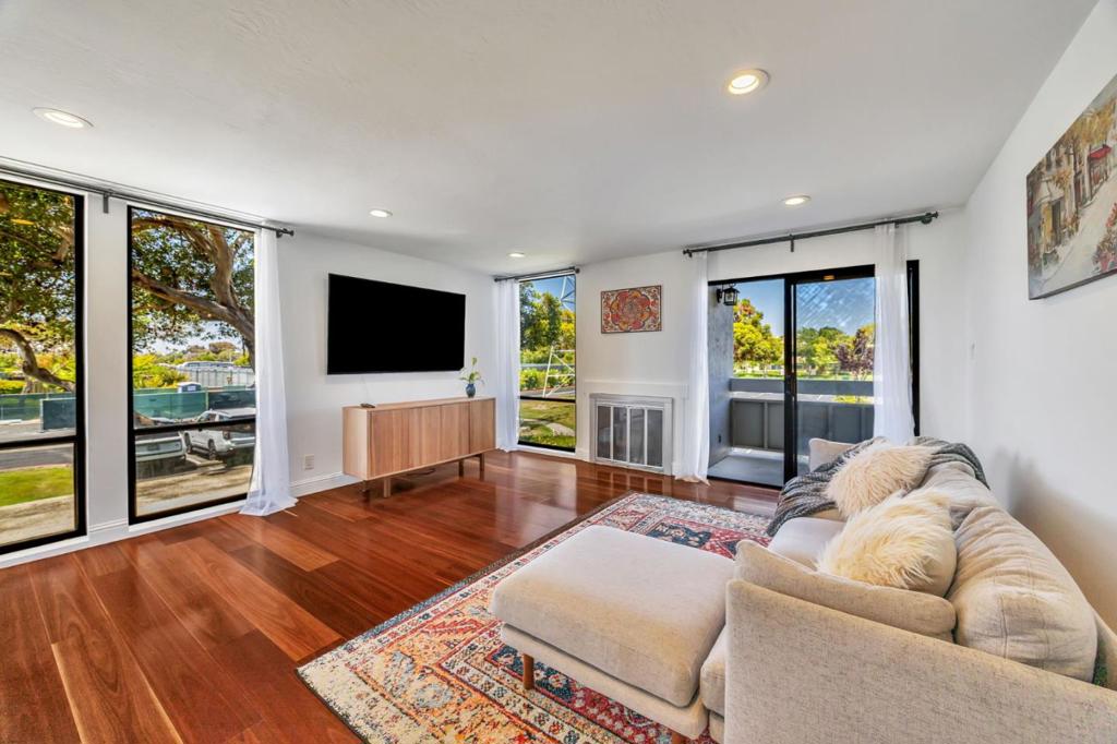 Welcome to this spacious 2-bedroom, 2-bath condo featuring an open-concept layout filled with natural light. The remodeled kitchen boasts quartz countertops, ample cabinetry, and seamlessly connects to the living and dining areas. Enjoy in-unit laundry and a private balcony, perfect for relaxing or entertaining. The primary suite offers a walk-in closet with custom built-ins and a beautifully updated ensuite bath. Additional features include hardwood floors (installed 2021), fresh interior paint, recessed lighting, plush bedroom carpeting, dedicated parking, guest parking, extra storage, and RV parking. Resort-style amenities include a pool, spa, clubhouse, tennis courts, playgrounds, and scenic walking trails. Adjacent to the Bay Backwater Trail for peaceful strolls and outdoor activities. Ideally located near Hwy 101/92, Ranch 99, top-rated schools, parks, and major employers like Visa, Oracle, Gilead, and Rakuten. HOA includes water and garbage.