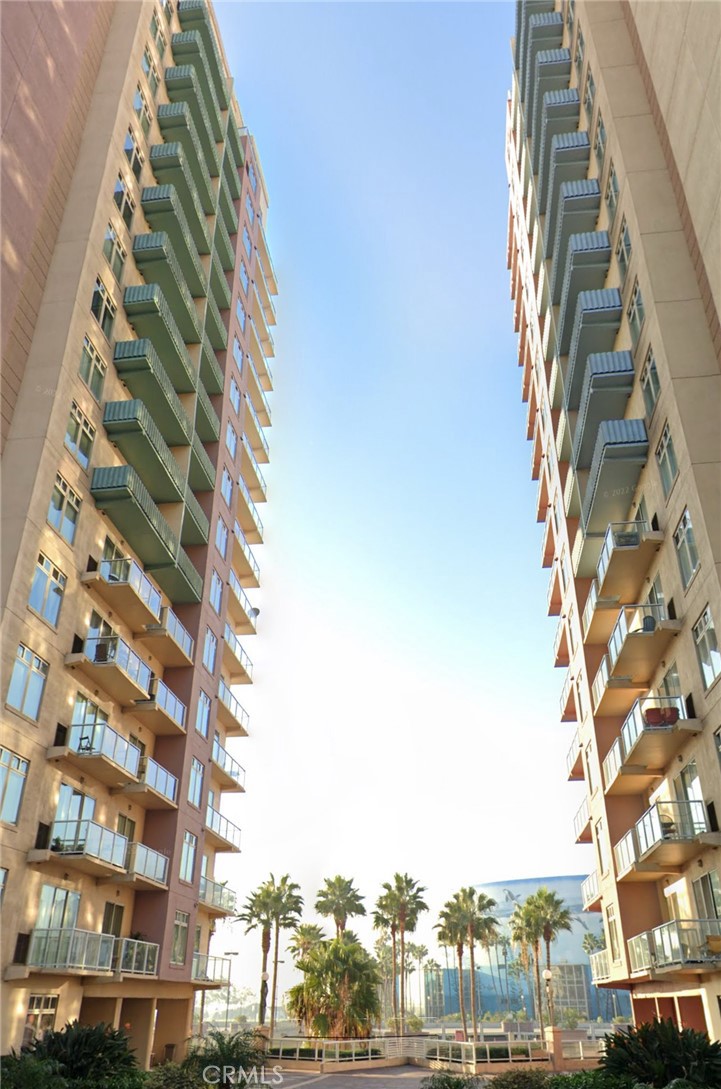 Gorgeous ocean view condo, 2 bedrooms and 2 baths! Welcome to the Aqua Building, a well situated high rise right on Ocean Blvd, walkable to stores, restaurants and the beach! This unit boasts views of the marina and water, cruise ships and the Queen Mary. The balcony overlooking the water is accessible by 3 sliders - 1 from the living room, and 1 from each bedroom. Each bedroom is a master suite with connected bathroom, and are located on either sides of the living area. The kitchen is open and has stainless steel appliances and contemporary cabinets, washer and dryer, and large pantry. This condo also has central heat and air conditioning. The Aqua Building has 24 hour concierge, pool, fitness center, and club/social room. Live in luxury in downtown Long Beach and enjoy the lifestyle at a price that is excellent for the location and amenities!