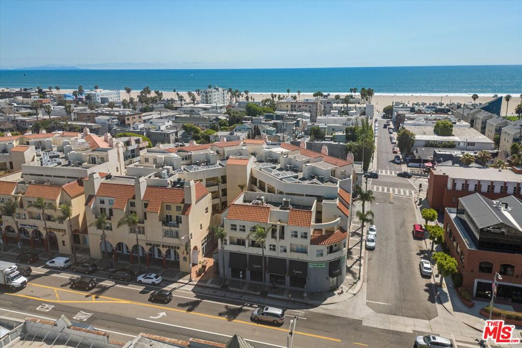 Live your L.A. beach city dreams for under $900K. This light-filled 2-bed, 2-bath corner home inside the award-winning Venice Renaissance, designed by Johannes Van Tilburg, offers the perfect blend of charm, livability, and location. You're just two blocks from the beach and surrounded by everything that makes this part of Coastal LA so appealing. Main Street, Abbot Kinney, and Rose Avenue all at your feet! Featuring original Saltillo tile floors, a decorative gas fireplace, and the kind of breezy cross-ventilation you only get in a corner unit. Move in and enjoy as-is, or tap into the potential and make it your own. Highlights include: Open living and dining area with fireplace. Kitchen with breakfast bar. Spacious primary suite with private interior patio, Ensuite bath with soaking tub, double vanity, and walk-in closet. The second bedroom is ideal for guests, office, or creative space. Large outdoor patio with room to dine, lounge, or garden. Two gated parking spaces plus private storage. Community amenities include a pool and spa, ground level retail/restaurants, and a tranquil meditation garden. This move-in ready home delivers value, location, and that breezy Venice lifestyle we all love.