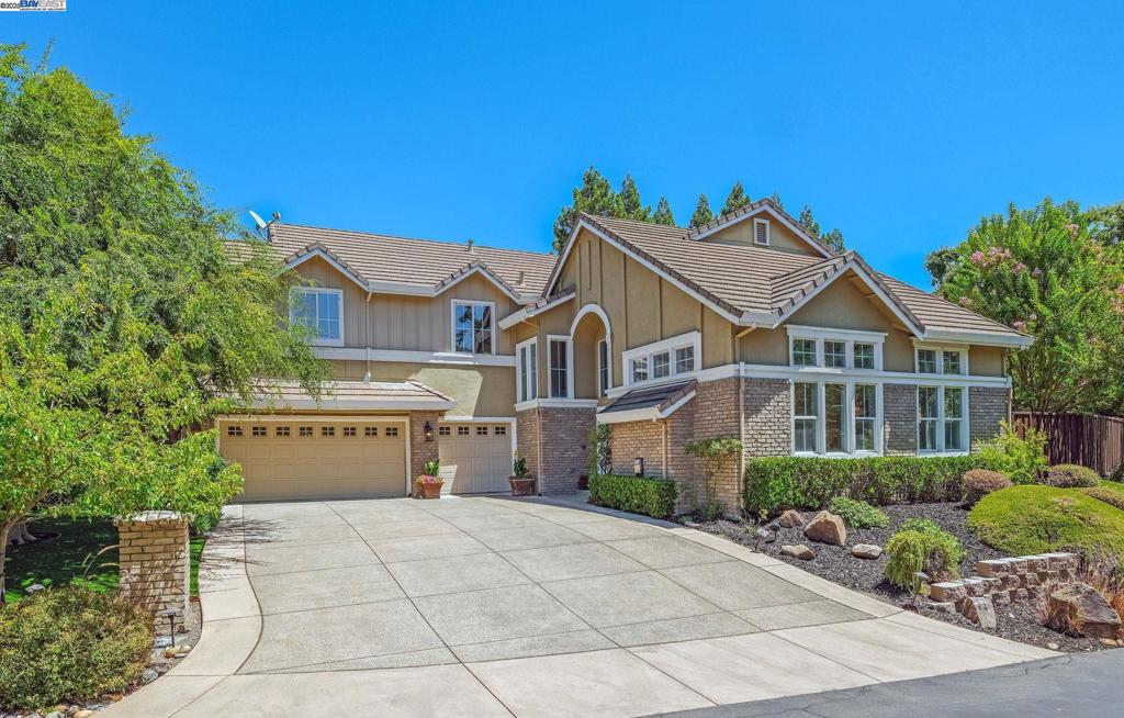 SHOWS LIKE NEW: Stunning, light-filled 5BR/3BA executive home in the exclusive gated community of Stone Castle Estates. This private community offers a home beside a tranquil creek of running water, with 3195 sqft home that is ideal for both family living and upscale entertaining in the manicured, flat yard. A grand marble entry leads to soaring ceilings, hardwood and tile floors, and elegant finishes throughout. The chef’s kitchen features quartz countertops, white cabinetry, a large island, and a walk-in pantry, as well as Viking & Thermador appliances and a wine cooler. All of these elements flow seamlessly into a spacious family room with a fireplace and a custom-built-in media center. A main-level bedroom with a full bath is ideal for guests or a home office. Upstairs, four bedrooms surround a central bonus/media room. The spacious laundry room with a sunken sink and ample cabinetry, washer, and dryer. Bathrooms are elegantly finished with Restoration Hardware accessories. The beautiful backyard offers relaxation and a potential pool site, and fruit trees. Enjoy a 3-car garage with EV charger, Nest thermostats, NEW HVAC System, close to top-rated Walnut Creek schools, Local Alamo and Danville Downtowns, major freeways, Roundhill Country Club, trails! OPEN SAT/SUN-1.30-4pm!!