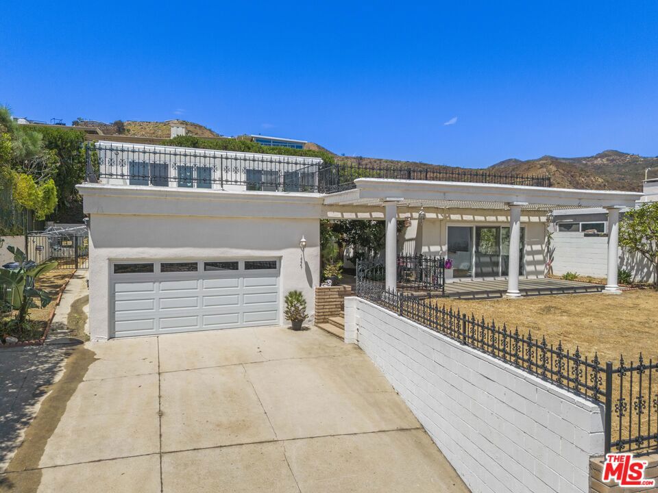 Beautiful Mid-Century Fixer with Breathtaking Ocean Views in Marquez Knolls! Perched in the highly sought-after Marquez Knolls neighborhood, this fabulous mid-century home offers expansive ocean views and timeless architectural charm. Unaffected by recent fires, the property remains a true original offering peace of mind and solid value in one of the most desirable pockets of the Palisades. Inside, you'll find a spacious floor plan with a fantastic layout that flows effortlessly from room to room - ready to be transformed into your custom dream home. Step into a welcoming atrium entryway that fills the home with natural light. Sliding glass doors frame ocean vistas from your living room creating an indoor-outdoor vibe. The home features four bedrooms and four bathrooms across 3,357 sqft of living space including a primary suite complete with spacious bathroom, walk-in closet, and fantastic ocean views. There's also an incredible opportunity to potentially expand the home by completing the second floor, which currently has two bedrooms including the primary suite. With roughly 1,000 square feet available for expansion, the potential to maximize both value and functionality is substantial. Don't miss this exceptional offering where mid-century charm meets endless potential and breathtaking views.