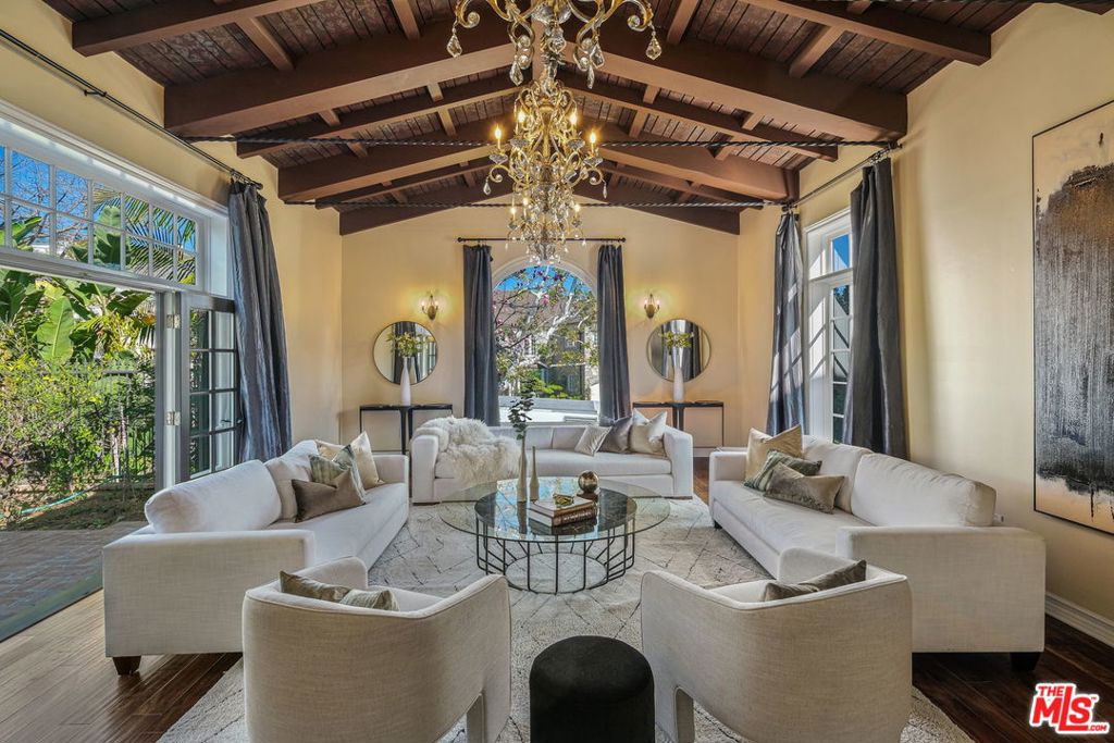 Secluded beyond the gates of the highly coveted Brentwood Circle is this stunning Spanish estate, home to a spacious 7,284 S.F. floor plan and unrivaled outdoor setting for quintessential California living. Through the elegantly adorned foyer, an open layout flows from the main level great room, complete with vaulted ceilings, a fireplace and floor-to-ceiling windows, and onward into the formal dining area, adjacent living room and state-of-the-art chef's kitchen. The home offers five en suite bedrooms upstairs, including the beautiful master suite with a generous bathroom, private balconies and adjoining lounge area, as well as a second master suite on the main level. Beyond the home's interior lies an expansive and truly rare backyard with a built-in BBQ kitchen, pool, spa and manicured landscaping. Additional features include a home theater and indoor sauna. Pairing authenticity with modern luxury, this Spanish abode sets a new standard for Brentwood living.