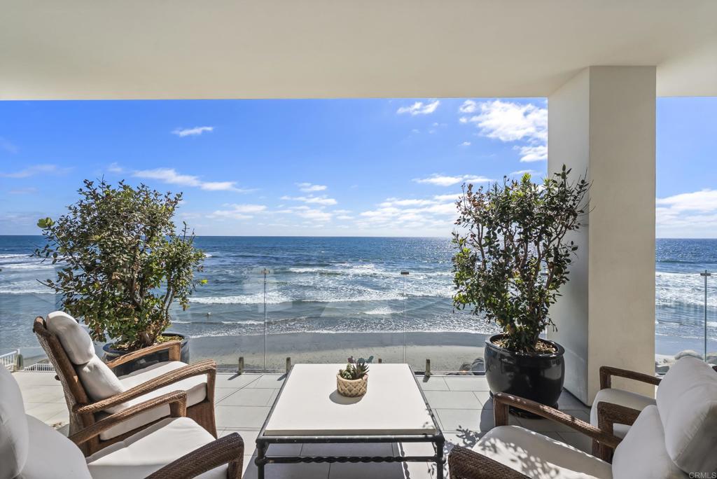 Set on an extraordinary 65-foot stretch of direct ocean frontage, 5067 Shore Drive is located in Terramar Beach—a somewhat hidden and beloved enclave known among surf aficionados. This rare opportunity invites you to experience true “toes-in-the-sand” living in one of North County’s most exclusive and private coastal communities. Sophisticated, timeless, and recently extensively upgraded, improved, and refreshed, this beachfront estate blends elevated design with luxurious materials, all framed by panoramic views of the Pacific. From the moment you step inside, the sound of the waves and the sea breeze set a tranquil tone. Every room in the home enjoys a front-row seat to the ocean, including the open-concept kitchen, living and dining areas, family room, the dedicated home office and especially the Primary suite. With four generous en-suite bedrooms, the floor plan is as functional as it is beautiful. The primary suite is a true retreat, complete with a spa-inspired bath, a library/office, and a boutique-sized walk-in closet designed to delight even the most discerning fashion enthusiast. The kitchen is a standout showpiece, perfect for those who dream of “cooking with a view.” Framed by floor-to-ceiling glass that invites in the shifting light as the sun moves across the sky and ultimately sinks into the sea at sunset, this space features top-tier appliances, custom cabinetry, sleek countertops, and a layout ideal for entertaining. Whether preparing an intimate meal or hosting a sunset gathering, the kitchen’s unobstructed views and coastal ambiance elevate every culinary moment. Beyond the interiors, homeowners in this rare, oceanfront community enjoy immediate, unmatched "toes-in-the-sand" access to the shore—placing the sand and surf just steps from your door. Located minutes from the vibrant and picturesque charm of Carlsbad Village and just a short drive from Palomar Airport—San Diego’s preferred hub for private aviation—5067 Shore Drive offers an unrivaled combination of coastal serenity and convenience. A home of this caliber, in a setting this rare, comes along once in a lifetime. Don’t miss the opportunity to live where luxury meets the sea.
