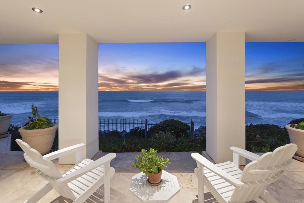 Set on an extraordinary 65-foot stretch of direct ocean frontage, 5067 Shore Drive is located in Terramar Beach—a somewhat hidden and beloved enclave known among surf aficionados. This rare opportunity invites you to experience true “toes-in-the-sand” living in one of North County’s most exclusive and private coastal communities. Sophisticated, timeless, and recently extensively upgraded, improved, and refreshed, this beachfront estate blends elevated design with luxurious materials, all framed by panoramic views of the Pacific. From the moment you step inside, the sound of the waves and the sea breeze set a tranquil tone. Every room in the home enjoys a front-row seat to the ocean, including the open-concept kitchen, living and dining areas, family room, the dedicated home office and especially the Primary suite. With four generous en-suite bedrooms, the floor plan is as functional as it is beautiful. The primary suite is a true retreat, complete with a spa-inspired bath, a library/office, and a boutique-sized walk-in closet designed to delight even the most discerning fashion enthusiast. The kitchen is a standout showpiece, perfect for those who dream of “cooking with a view.” Framed by floor-to-ceiling glass that invites in the shifting light as the sun moves across the sky and ultimately sinks into the sea at sunset, this space features top-tier appliances, custom cabinetry, sleek countertops, and a layout ideal for entertaining. Whether preparing an intimate meal or hosting a sunset gathering, the kitchen’s unobstructed views and coastal ambiance elevate every culinary moment. Beyond the interiors, homeowners in this rare, oceanfront community enjoy immediate, unmatched "toes-in-the-sand" access to the shore—placing the sand and surf just steps from your door. Located minutes from the vibrant and picturesque charm of Carlsbad Village and just a short drive from Palomar Airport—San Diego’s preferred hub for private aviation—5067 Shore Drive offers an unrivaled combination of coastal serenity and convenience. A home of this caliber, in a setting this rare, comes along once in a lifetime. Don’t miss the opportunity to live where luxury meets the sea.