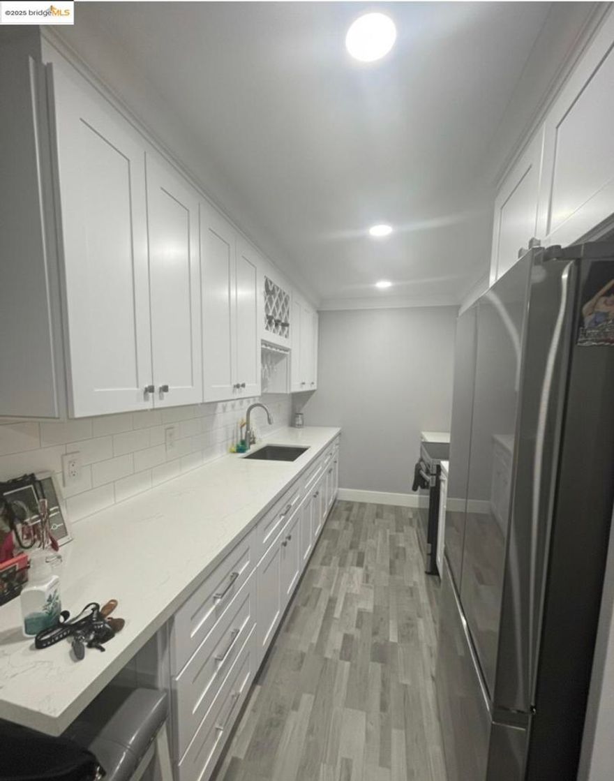 Fabulous, Updated Condo on the second floor. kitchen is updated with white cabinets, quartz counter tops with white sub way tiles back splash, laminate flooring with stainless steel appliances. Laminate floors throughout. Updated bathroom with tiled bathroom floors. Newer paint throughout. Balcony overlooking the community pool. close to Bart and walking distances to shops and restaurants.