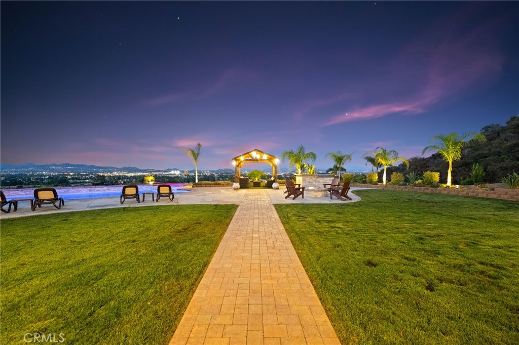 The most epic and amazing views to date in West Murrieta's most coveted neighborhood. Boasting 180-degree views overlooking the city lights and mountains, this spectacular 2.75-acre property has everything you could imagine. The custom pool/spa is tranquil and provides a serene space to unwind after a busy day. The interior is grand with vaulted ceilings upon entering, looking straight through to the vast backyard. Not only does the primary suite have a giant soaking tub and walk-in shower, it also has his and hers closets. One of the secondary bedrooms is a mother-in-law suite with its own living room, dining, bathroom, and bedroom. This home was a custom build with high-end finishes throughout. Don't miss this opportunity to own a piece of paradise in one of the best neighborhoods Murrieta has to offer.