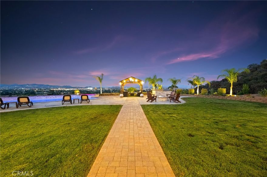 **Back on the market no fault of the sellers** The most epic and amazing views to date in West Murrieta's most coveted neighborhood. Boasting 180-degree views overlooking the city lights and mountains, this spectacular 2.75-acre property has everything you could imagine. The custom pool/spa is tranquil and provides a serene space to unwind after a busy day. The interior is grand with vaulted ceilings upon entering, looking straight through to the vast backyard. Not only does the primary suite have a giant soaking tub and walk-in shower, it also has his and hers closets. One of the secondary bedrooms is a mother-in-law suite with its own living room, dining, bathroom, and bedroom. This home was a custom build with high-end finishes throughout.  Don't miss this opportunity to own a piece of paradise in one of the best neighborhoods Murrieta has to offer.