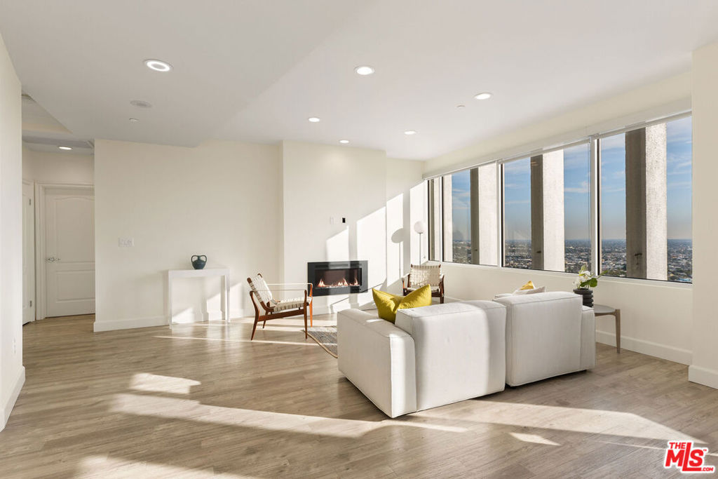 Private Penthouse suite located located on the top level of a sky rise office building with panoramic views 2 bedrooms and 2 baths. Abundant natural light with floor to ceiling windows throughout the space. Private balcony. Renovated kitchen with new appliances and breakfast bar. Spacious and updated primary bathroom with separate shower and tub, dual vanity sinks, and a sauna. Walk in closets. Central AC. Laundry in unit. Newly equipped gym, lounge area, screening room, and conference room all located on site. Two garage spaces with electric vehicle charging stations available. Located in the heart of the Los Angeles with close proximity to museums, shopping, dining, and downtown LA.