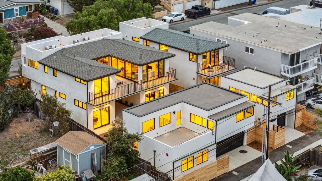 Stunning new construction in Cardiff’s iconic Walking District! 2052 Montgomery Ave blends sophisticated coastal style with spacious modern living and panoramic ocean views. This thoughtfully designed 4 bedroom, 3 bathroom, 2553 SF home showcases refined architectural details and top-tier craftsmanship throughout. Glass doors open to a spacious view deck, while a private rooftop deck elevates the experience with even more spectacular coastal panoramas. At the heart of the home is a chef’s kitchen that blends style and function with striking natural stone countertops, custom wood cabinetry, built-in panel appliances, and a massive island with bar seating. The wide-open layout flows seamlessly into the dining area and living room, creating a light-filled, contemporary space with clean lines, warm finishes, and plenty of room to entertain. A beautifully appointed 2 bedroom, 1 bath detached, 1091 SF ADU adds flexibility—ideal for extended family, guests, rental income, or a private work-from-home space. The ADU also features its own expansive outdoor rooftop deck, creating an elevated sense of independence and comfort. With a finished 2-car garage, drought-tolerant landscaping, and exceptional attention to detail throughout, every inch of this property reflects quality craftsmanship and thoughtful design. Located just blocks from Cardiff’s charming town center, you’re minutes from Seaside Market, gourmet dining, boutique shopping, and some of North County’s best beaches and surf breaks. Whether you're grabbing morning coffee, biking the coast, or watching the sun dip into the Pacific, this home places you at the center of it all. A rare opportunity to own a brand-new, ocean-view property in one of San Diego’s most sought-after coastal communities.