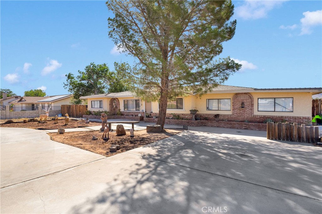 This charming single story ranch style pool home is nestled on a spacious over an acre lot with a wide circular driveway and natural desert landscaping.
This home offers 3 good size bedrooms and 2 bathrooms. Approximately 1500 square feet of living area plus a detached 2 car garage. The inviting formal living room his wide and is open to the formal dining room, natural light fills the rooms enhancing the soft neutral tones of the walls. The kitchen has granite countertops, a cooktop, oven and lots of upper, lower cabinets, and a breakfast bar. It has beautiful tile flooring that expands to the walls giving it a modern feel and character. The back yard is perfect for entertainment with a pool and plenty of room for your creativity. It has a covered patio and a detached car garage. There is also a large workshop space attached with the 2 car garage that can be use to work on cars or anything you may have in mind. The expansive back yard is partially cemented and some areas are not, left for you own project. Don't miss out on this beautiful home.