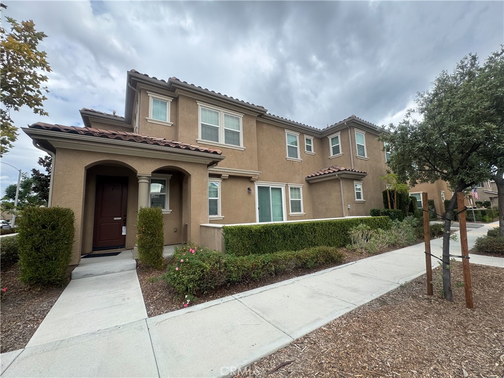 This beautiful home offers 4 bedrooms and 3 full bathrooms. located in the heart of Eastvale, The kitchen features a walk-in pantry, granite countertops, white cabinets, and built-in appliances including two ovens, a microwave, and an exhaust fan over the gas range. The large island opens to the dining area, living room, and adjacent patio, perfect for entertaining.The main floor includes a bedroom with a full bath. Upstairs, the master bedroom boasts a spacious walk-in closet, dual vanities, a bathtub, and a shower. The home also features a large laundry room with cabinets and a sink, Additional highlights include a two-car garage with a tankless water heater. Conveniently located near schools, a movie theater, shopping centers, and easy access to the 60, 91, and 15 freeways. HOA amenities feature a pool, Jacuzzi, indoor and outdoor lounges, and a fitness room.