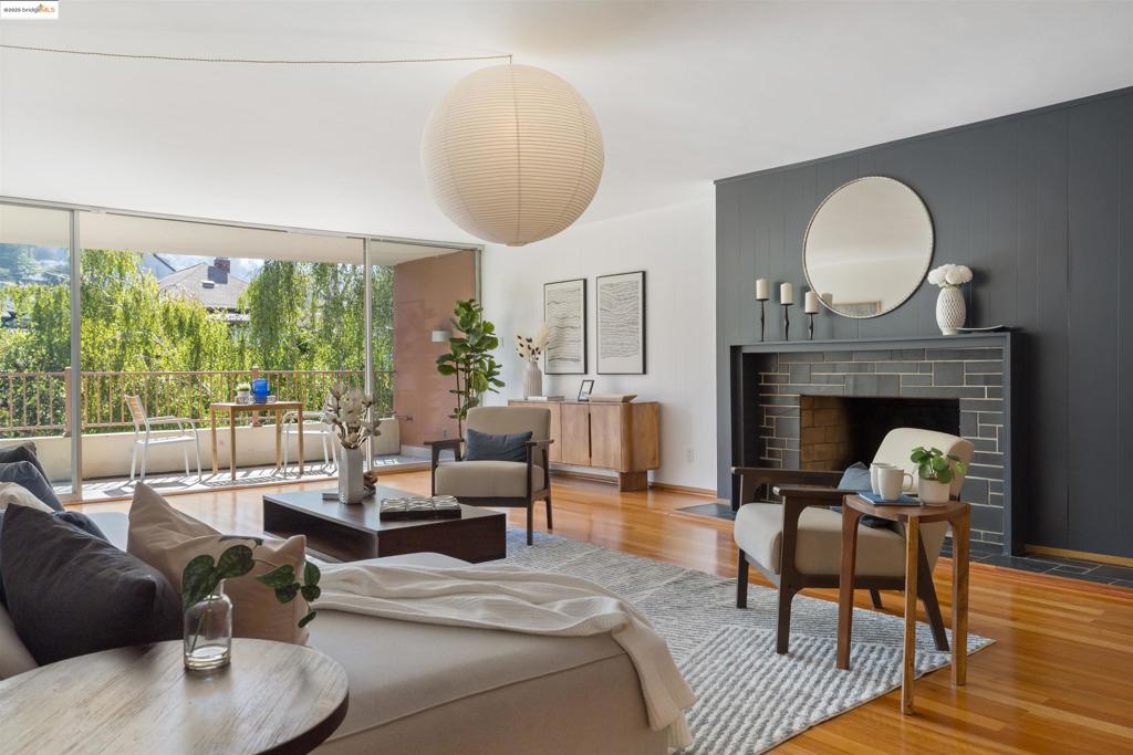 Centrally located in walkable North Berkeley, 1515 Oxford Street #3D is a beautiful and expansive residence. This Mid Century Modern unit is all on one level in a rare elevator building. Its large, open floor plan has aged beautifully- floor to ceiling doors in the living room and bedrooms let in morning light and give access to a private covered patio. Featuring two bedrooms, two bathrooms and ample storage, this top floor unit has surprisingly verdant outlooks of the Berkeley hills and local gardens. Other amenities include one garage parking spot, a cozy fireplace, a large kitchen, and access to a roof level event space with to die for bay views. This unit is a two minute walk to all the best North Berkeley food and shopping, yet is quiet, private and serene. Experience luxurious, all level living in one of Berkeley's most coveted locations!