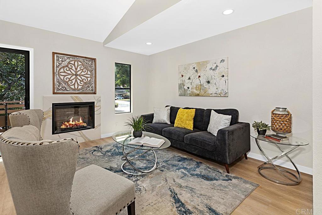 Gorgeous fully remodeled 2-bedroom, 1-bath condo in the heart of Scripps Ranch, offering modern finishes, resort-style amenities, and a highly convenient location. This upper-level home features an open-concept layout with all-new flooring, fresh paint, new doors, and updated cabinetry in top designer colors. The stunning kitchen is equipped with stainless steel appliances, quartz countertops, and a full quartz backsplash, flowing seamlessly into the living and dining areas with vaulted ceilings that create a spacious and airy feel. The spa-like bathroom showcases quartz countertops and designer tile accents. Enjoy a private balcony surrounded by lush tree-lined views—perfect for relaxing outdoors. The well-maintained community offers multiple sparkling pools, beautifully landscaped grounds, and a peaceful setting. Located just minutes from the I-15 freeway, shopping, dining, and outdoor recreation, this home delivers both style and convenience in one of San Diego’s most desirable neighborhoods. A true must-see!