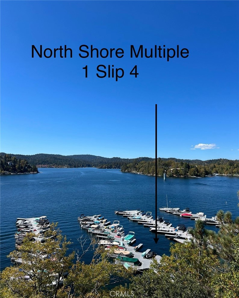 North Shore Multiple #1, Slip 4 is ideally situated right in front of a sandy beach, nestled beside a lush grassy lawn, a convenient picnic area, a fishing dock, and nearby restrooms. Just a short walk away, you'll find the ALA Marina and the exciting new lakeside restaurant, The Galley—perfect for grabbing a bite after a day on the water.
From the dock, enjoy sweeping 180-degree lake views that stretch all the way to Lake Arrowhead Village. It’s a front-row seat to the stunning fireworks displays—imagine watching them light up the sky right from your own dock and private beach.
Access is a breeze: take ALA #63 at the corner of North Shore and Hwy 173, or simply park along Hwy 173 and stroll through the Marina. With its unbeatable location and serene surroundings, this is your chance to relax and unwind in a truly idyllic lakeside setting. NOTE: Boat NOT included.