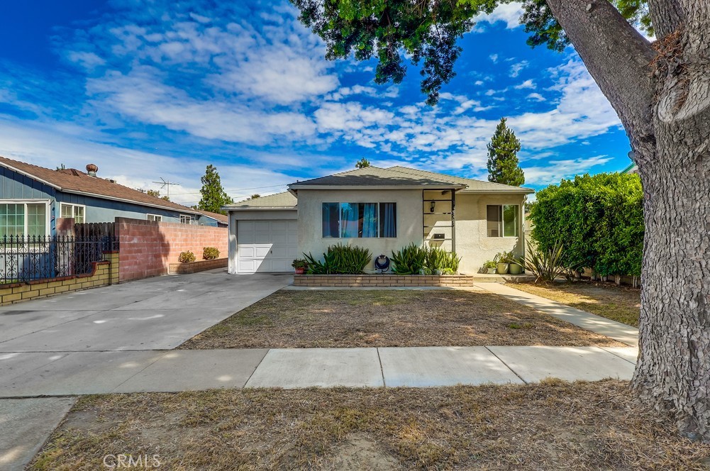 LOCATION! LOCATION! LOCATION! This home is the perfect spot for a family ready to make lasting memories in Norwalk! The original home has 2 bedrooms and 1 bath, the one car garage is now converted to living area and it offers the possibility of a third bedroom. This home boasts a very nice remodeled bathroom. Besides the original 1 car garage, there is a two car detached garage and carport in the back of the lot. Owner has approved construction plans, will need to be updated, to expand the home to over 1500 square feet. The lot has two entrances, front and back. Brimming with great ADU potential!!!!!. From this location you can get to the various freeways within a 5 minute drive, the 5, 605, 105 and 91 freeways. Close to all conveniences such as: Public transportation, shopping, Churches, Elementary School and Cerritos College are extremely close by. Show 'n' Sell.