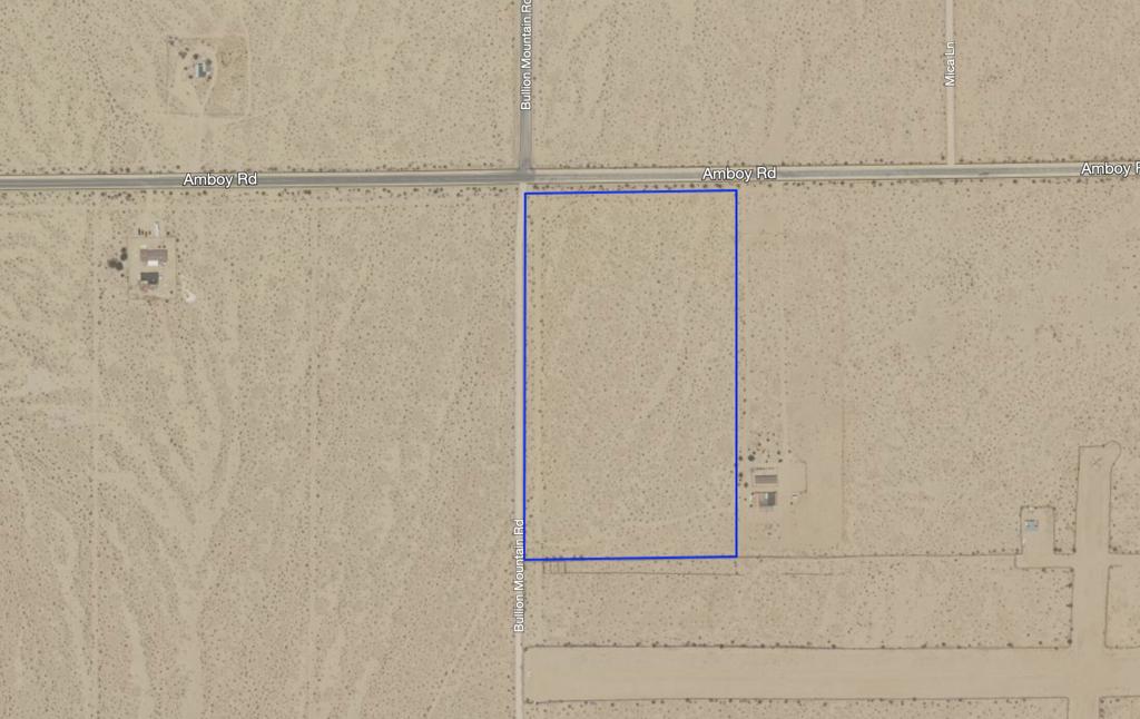 Development potential! 17.7-acres on the SE corner of Amboy Rd and Bullion Mountain Rd. Zoning allows for +/- 7 houses (one dwelling per 2.5 acres) if subdivided. Zoning allows for a number of industrial uses along with solar power generation (subject to CUP). Power on Amboy Rd. APN: 0624-311-05-0000