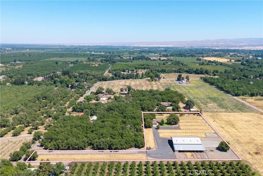 Well thought out equestrian estate on the western edge of Chico - opportunities for property like this don't come along often! There are five level acres with a covered arena, a six stall, 100' long, horse barn with a tack room, bathroom, heated wash rack and hay storage area! The property has been fenced into 8 irrigatable pastures, with 6 additional runs off the barn, a round pen, and then the 2,068 sq.ft. custom home at the corner of the property. Each pasture is fenced with no climb horse fence and has water and sprinklers available, not currently irrigated.  Drive up the lane to the custom three bedroom, two bath home, was built in 1988 and has only had one owner. The living room has vaulted beam ceilings, a brick hearth and propane fireplace. There is a formal dining room, with a slider to a cool and shady covered patio that runs the length of the north side of the home.   The kitchen has tile floors, Corian counters, oak cabinets and stainless fridge, with a bay window above the sink, overlooking the private side yard.  A light and bright breakfast nook overlooks the front yard, pastures and towards the barn. The primary bedroom has a walk-in closet next to the primary bath, and it's own slider leading to the back patio. The yard is nicely landscaped, auto sprinklers and behind it there is a small orchard, grapes and plenty of room for a spacious garden.  The property has a gated entrance, two wells and the barn has it's own septic, with RV hookups. Both septics have just been pumped. There is also a Generac generator for the house, in case of power outages. In just two minutes, you can be back in Chico and picking up groceries at Safeway.  CA State University Chico and Enloe Hospital are both within a few minutes drive.  A couple miles to the west of the property, the Sacramento River meanders south, offering a wide variety of fishing opportunities. If you're looking for a lovely equestrian property and home, not far from town, please schedule your private tour!