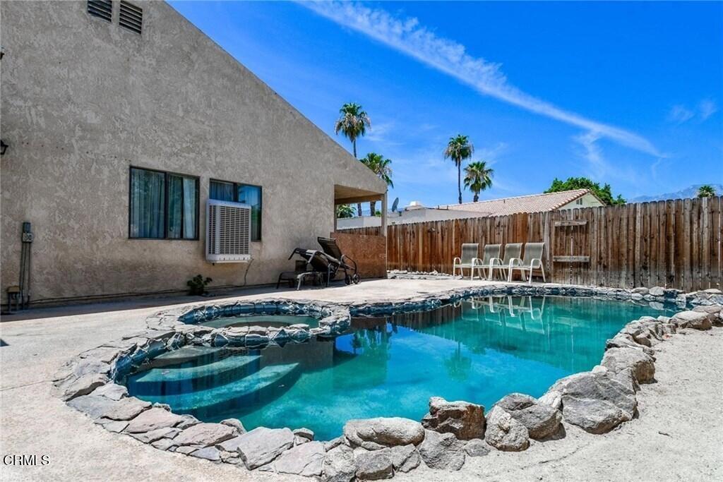 Charming 3 bedroom, 2 full bathroom, single story home with peek mountain views on a large corner lot with sparkling swimming pool in the community of Cathedral City. This property features a spacious driveway, large side yard, and a front porch entry to the open floor plan with tile flooring throughout. The kitchen offers stainless steel stove and microwave, a breakfast nook, and views to the outdoor pool and patio. The large master bedroom features a large closet, ceiling fan, and shower-in-tub in the master bathroom. Close to area schools, dining, and entertainment.