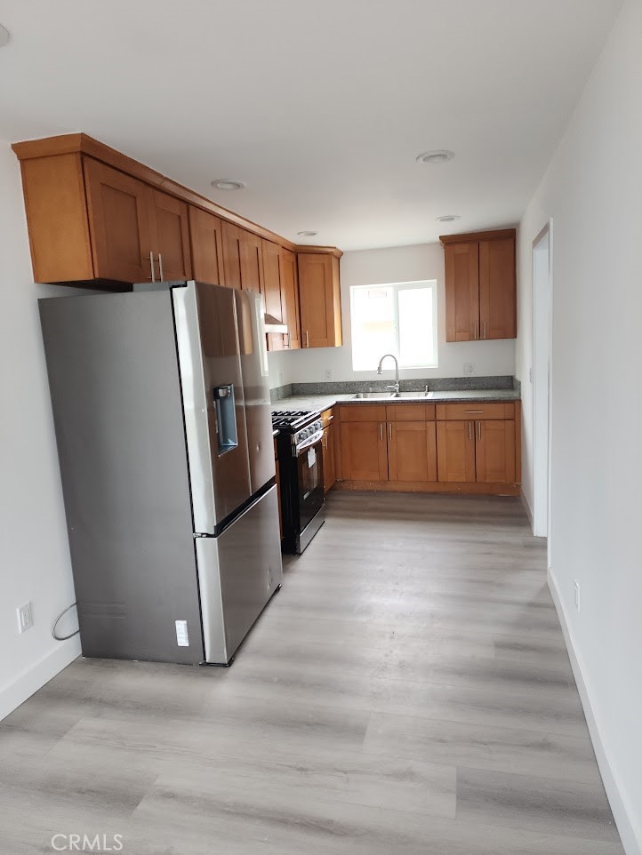 Beautiful two-bedroom one bath home in central Corona area for rent. This home features an enclosed area as you enter that property that could be a sitting area, then you enter into the home to the living room. There is a very nice kitchen with all appliances included. There is a good-sized bedroom and bathroom as well. The home has been renovated and has new vinyl plank flooring throughout and neutral paint. This unit is attached to an ADU with 1 bedroom 1 bathroom. The home is located in the front with a nice, landscaped front yard that is fenced. There are two other units on the same lot.