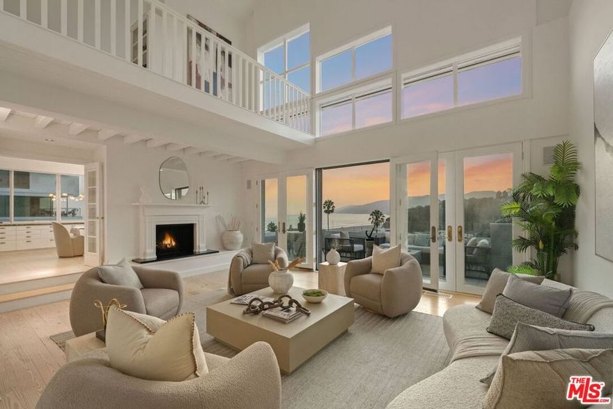 Spectacular Ocean and Canyon Views from nearly every room of this trophy home! Exceptional Ocean Avenue Extension location ideally situated near the beach and just  block from Palisades Park! Over 6,200 sqft of living space with a flexible floorplan featuring a brand-new elevator, four bedrooms and lap swimming pool with spa. High ceilings and phenomenal art walls (if you need a break from the breathtaking beauty of the sparking Pacific Ocean and bejeweled Santa Monica Bay coastline). Beachy chic with light hardwood floors, large balconies, remote shades, solar panels, 3-zone HVAC, and loads of closet space! The large 6,120 sqft lot provides fantastic parking with a gated driveway and attached garage. Living room with fireplace, gorgeous dining room and large family room all enjoy the most incredible view! A separate guest wing with direct access could be an exceptional work-from-home option or ADU. Enjoy world-class sunsets from the generous primary suite which boasts a fireplace, sitting room, private deck, dual bathrooms and plenty of walk-in closet space. There is also a huge game/media room plus a "pantry room" and laundry & folding room. Bask in the afternoon sun and soak up wraparound views from the swim deck! Easy beach access via tunnel, just a block away! There is also an additional flexible-use space below the home (820 sqft which is not included in the square footage) that could easily convert to recording/art studio space or just about anything you can imagine. Homes like these rarely come to market and are not to be missed!