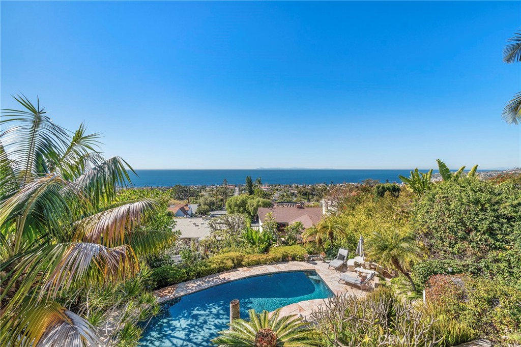 Escape to your own slice of paradise at 875 Coast View, Laguna Beach. From the moment you arrive, you'll be captivated by the breathtaking panoramic ocean views that surround you. Take a dip in your private heated pool while enjoying the stunning ocean vistas, or unwind with friends and family around the cozy fire pit.
This spacious 4-bedroom, 2-bathroom home is tastefully furnished, offering the perfect blend of comfort and luxury. The property boasts a private courtyard and a beautiful, lushly landscaped backyard, complete with a serene Koi pond. The gourmet kitchen is fully equipped with modern appliances and a large pantry, providing the perfect setting for whipping up delicious meals while taking in the mesmerizing views of the Pacific Ocean and city lights.
Ideally located within walking distance of downtown Laguna and the beach, this home is the perfect base for exploring everything that this world-renowned destination has to offer. With a 2-car garage, you can rest assured that your vehicles will be safe and secure during your stay with EV Charging available.
Experience the ultimate beach getaway with all the amenities you need for an unforgettable experience. Book your stay at 875 Coast View today! Inquire for Summer Pricing.