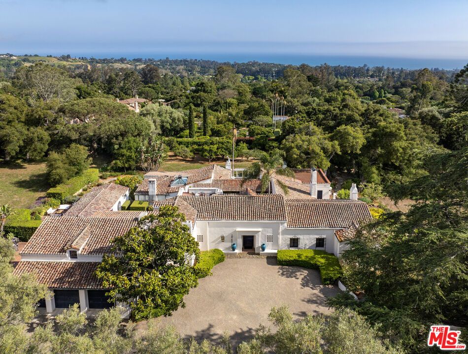 It doesn't get any more quintessentially Montecito than this! Spanish Colonial Revival architecture, courtesy of architect Mary Craig, is ripe with wrought iron, smooth white stucco, Santa Barbara stone walls, weathered tile, beautifully carved doors, and 1930's glamour. The ocean view estate known as La Macarena presides over 1.99 acres in the heart of the Golden Quadrangle and embodies a worn elegance earned over nearly a century of seasons. Designed around a central courtyard with eight sets of French doors leading to nearly every room, the home orbits around this integral space. Available to the market for the first time in 50 years, this piece of history is the perfect canvas to create your version of the California Dream.