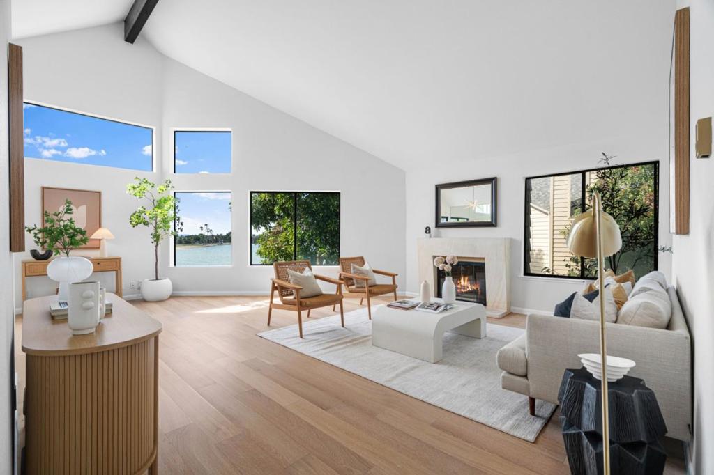 Spectacular wide-water views await from this beautifully updated 2-bedroom, 2-bathroom top-floor condo in San Mateo's coveted Harbortown community. This light-filled residence features freshly remodeled bathrooms, an updated kitchen with quartz countertops, and an open living/dining area with beautiful vaulted ceilings and cozy wood-burning fireplace, creating a move-in ready sanctuary. Enjoy the convenience of in-unit washer/dryer and a detached 1-car garage. The prime location offers easy access to Highway 92/101/280, SFO, and major employers, with Bridgepointe and Hillsdale Shopping Centers just minutes away. San Mateo Central Park is nearby with 16.5 acres of urban beauty, including rose and Japanese tea gardens. Harbortown's resort-style amenities elevate everyday living with an indoor pool, outdoor in-ground pool, outdoor jacuzzi, tennis and pickleball courts, clubhouse, boat dock with storage, community garden, and scenic waterfront trails along the lagoon. Guest parking and meticulously maintained grounds complete this exceptional waterfront lifestyle. Located near highly-rated schools including Aragon High School (buyer to verify). This is vacation-style living at its finest. Your tranquil retreat awaits in one of San Mateo's most desirable waterfront communities.