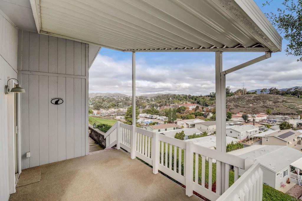 Enjoy northern panoramic views from the porch, dining area, and kitchen. Cooks will love the roomy kitchen including gas range, center island, over the range microwave, an abundance of cabinets, and 2 pantries. Dining nook, plus a large combo living room and dining room with vaulted ceilings in this well thought out floorplan. A tremendous value for a detached home only 20 years old! Primary resident needs to be 55 years of age or older but spouse can be younger and the owner can be any age. It's move in ready with laminate wood floors in the living area and carpet in the bedrooms. 3 possible bedrooms with one currently set up as an office. The large primary bedroom has a spacious walk-in closet while the bathroom shines thanks to a new walk-in tub/shower combo. There's central heat and A/C , ceiling fans, and dual pane windows to keep you comfortable year round! Don't forget the solar panels pretty much eliminate electricity costs. Handy laundry room has cabinets, sink, and a place to hang clothes as they finish drying. High up in the gated community you'll find a lot of privacy and abundant guest parking (right across the street). The outdoor shed offers more space for your stuff and the carport/driveway area can fit 2-3 vehicles (eg. 2 cars and a golf cart). Rancho Escondido is a gated community with plenty of activities at the clubhouses including 2 pools, spa, shuffleboard, exercise room, and more. RV parking available. HOA dues cover water, trash, basic cable, and common area maintenance.