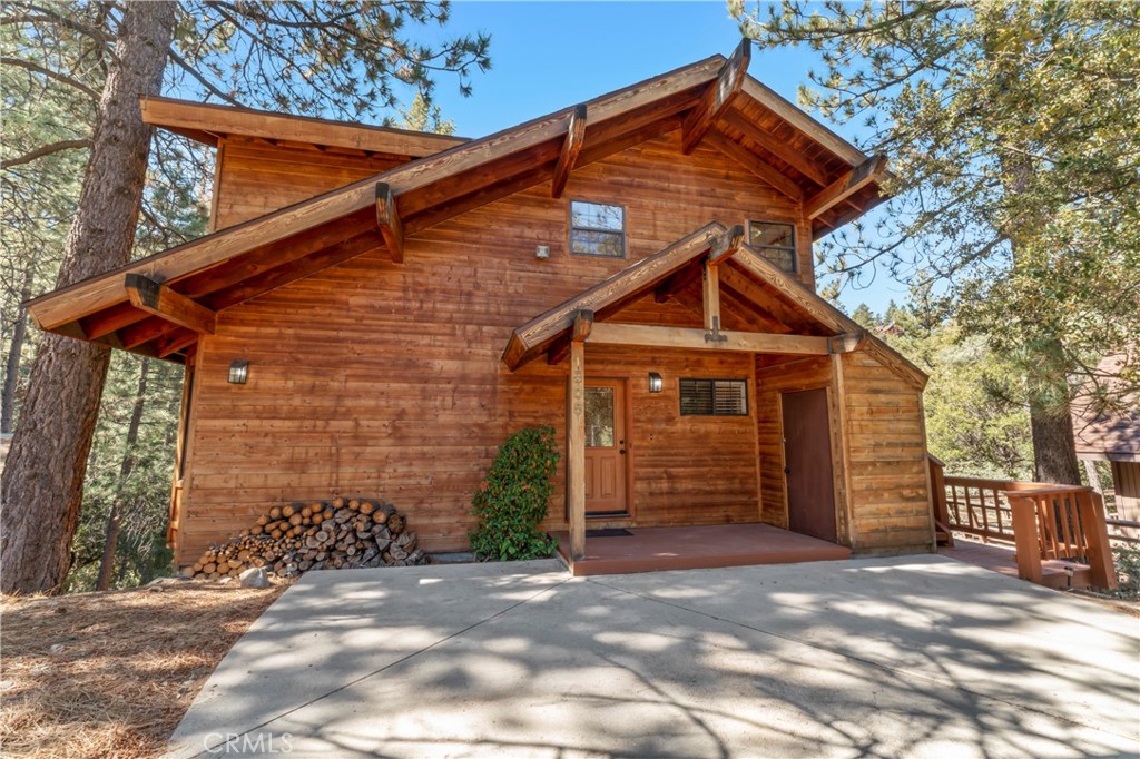 NEW ROOF – July 2025! Tucked away in the peaceful setting of Pine Mountain Club, this stunning mountain home offers the perfect balance of luxury and nature. With 4 bedrooms, 4 baths, and over 3,000 square feet of thoughtfully designed living space, this property is a true retreat. Step inside to soaring vaulted tongue-and-groove ceilings, rich Brazilian hardwood floors, and oversized windows that frame the surrounding pines. The chef’s kitchen is built for both everyday living and entertaining, complete with double ovens, a separate cooktop, walk-in pantry, wine fridge, and plenty of workspace.
The home’s design combines elegance with rustic charm—imported stone tile and countertops bring a refined, earthy feel. Multiple heating sources including a fireplace, pellet stoves, and a wood stove keep things cozy all winter long. The spacious primary suite features a pellet stove, views of the greenbelt, and a spa-like en-suite with a stone step-down shower and separate water closet. The lower-level bedroom has its own entrance, full bath, and deck—perfect as a guest suite, bonus room, or private quarters. Outside, you’ll love the sense of privacy and quiet, with expansive decks on both levels backing to open greenbelt and towering Jeffrey and Ponderosa pines. It’s a true mountain escape, just minutes from the village center.
Pine Mountain Club offers year-round recreation, including hiking, golf, tennis, and a community pool. Don’t miss the 3D tour and drone footage to experience all this property has to offer.