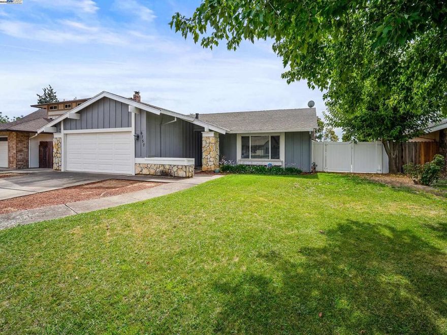 Beautiful 4-Bedroom Home in a Desirable Neighborhood. This delightful 4-bedroom, 2-bathroom home offers 1,719 sq. ft. of comfortable living space designed for both relaxation and entertaining. With its inviting curb appeal, landscaped front yard, and welcoming front porch, this residence is ready to impress. Step inside to a bright and airy open-concept layout, where large windows fill the living spaces with natural light, creating a warm and inviting ambiance. The generous sized kitchen provides plenty of counter space, ample cabinetry, and a cozy breakfast nook overlooking the backyard—perfect for enjoying morning coffee while watching children or pets play. Sliding glass doors open to a private backyard retreat, ideal for outdoor dining or peaceful relaxation. The primary suite serves as a serene sanctuary with its spacious layout and luxurious en-suite bath. Three additional bedrooms offer versatility for family/guest accommodations, a home office, or a playroom to suit your lifestyle. Located near shopping, dining, and parks, this home blends comfort, convenience, and charm in one perfect package.