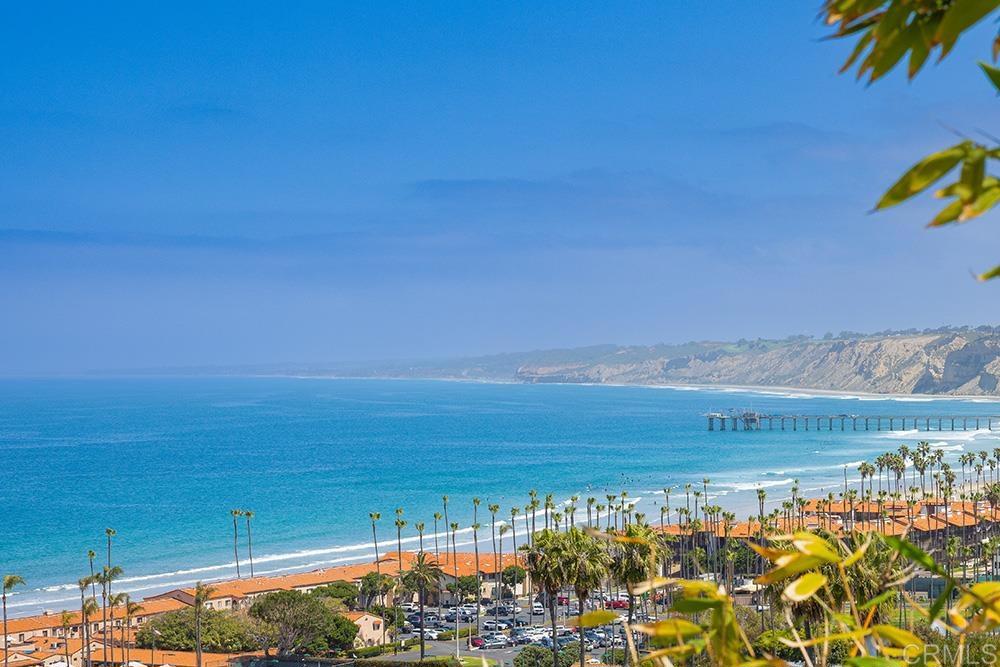 VIEWS VIEWS VIEWS! Exquisite one of a kind contemporary masterpiece with unrivaled ocean views in La Jolla. Commandingly positioned in La Jolla’s highly coveted Country Club enclave, this exceptional coastal residence captures uninterrupted ocean views from every level. A true architectural gem, this home is an elegant fusion of sophisticated design and the beauty of Southern California’s coastline. Encompassing approximately 3,597 square feet of thoughtfully curated living space, the home features five generously sized en suite bedrooms. Designed with the entertainer in mind, the open-concept layout is defined by high entry ceilings, walls of glass, and seamless indoor-outdoor transitions that invite the sea breeze into every corner. The mid-level rooms opens to an expansive view deck—an idyllic setting for sunset gatherings or al fresco dining under the stars. On each level, ocean view private terraces offer intimate spaces to unwind while enjoying the hypnotic rhythm of the Pacific. Inside, sleek contemporary finishes, bespoke details, and premium materials reflect an uncompromising commitment to quality. The result is a home that feels both elevated and inviting, ideal for discerning buyers seeking a luxurious primary residence or an exceptional coastal retreat. Just moments from La Jolla’s renowned beaches, championship golf courses, fine dining, boutique shopping, and top-rated schools, this residence represents an extraordinary rare opportunity to own one of the most view-centric homes in one of California’s most prestigious seaside communities.