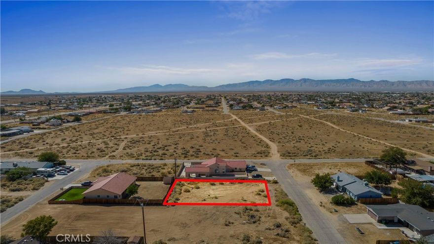 Prime ±0.23 acre (10,002 SF) infill lot located in the heart of California City. Surrounded by established neighborhoods and newer construction (2006 build to the south, 2021 build to the east), this property offers excellent long-term growth potential. Features include paved road frontage, block wall along the west side, water at the street, and power poles positioned on the west and rear property lines. Conveniently located just 8 miles from Hwy 14 via California City Blvd, with easy access to Mojave, Tehachapi, Golden Hills, and Lancaster. This is a well-situated parcel in an expanding area, ideal for building now or holding as an investment. Seller financing available with only 10% down — strong opportunity for ROI in a market showing steady development.