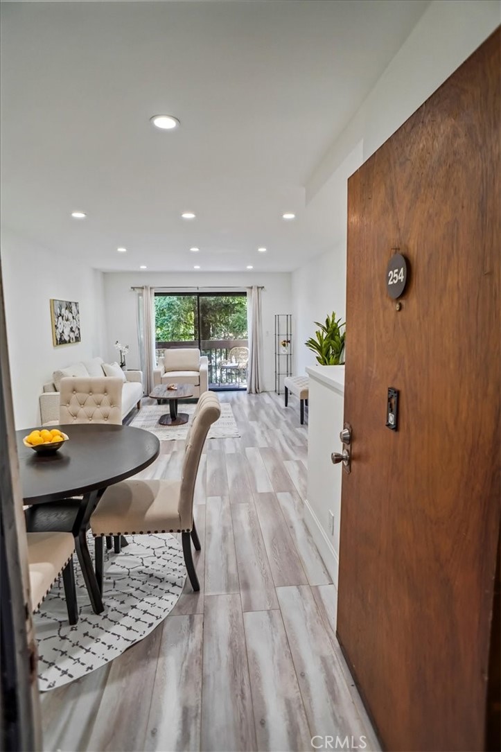 Step into this beautifully modern one-bedroom condo nestled in a gated community in the heart of Woodland Hills. Just a minute from the 101 Freeway, this charming unit offers both convenience and comfort. The open-concept kitchen features sleek, spacious countertops that flow seamlessly into the living area, creating the perfect space for relaxing or entertaining. Enjoy your morning coffee or unwind at night on the large, private balcony – a peaceful retreat with room to lounge. The home includes a recently upgraded A/C unit (replaced just two years ago), one assigned parking spot, and ample guest parking for visitors. Designed with a cozy, welcoming vibe, this condo is ideal for anyone seeking a stylish yet relaxed lifestyle. Located within walking distance to local parks, shops, restaurants, and grocery stores like Trader Joe’s, Ralphs, Sprouts, and Whole Foods. You’re also just minutes from The Village and Westfield Topanga Mall. The community offers incredible amenities including a sparkling swimming pool, hot tub, sauna, gym, recreation room, and tennis court – perfect for enjoying an active lifestyle without even leaving home.