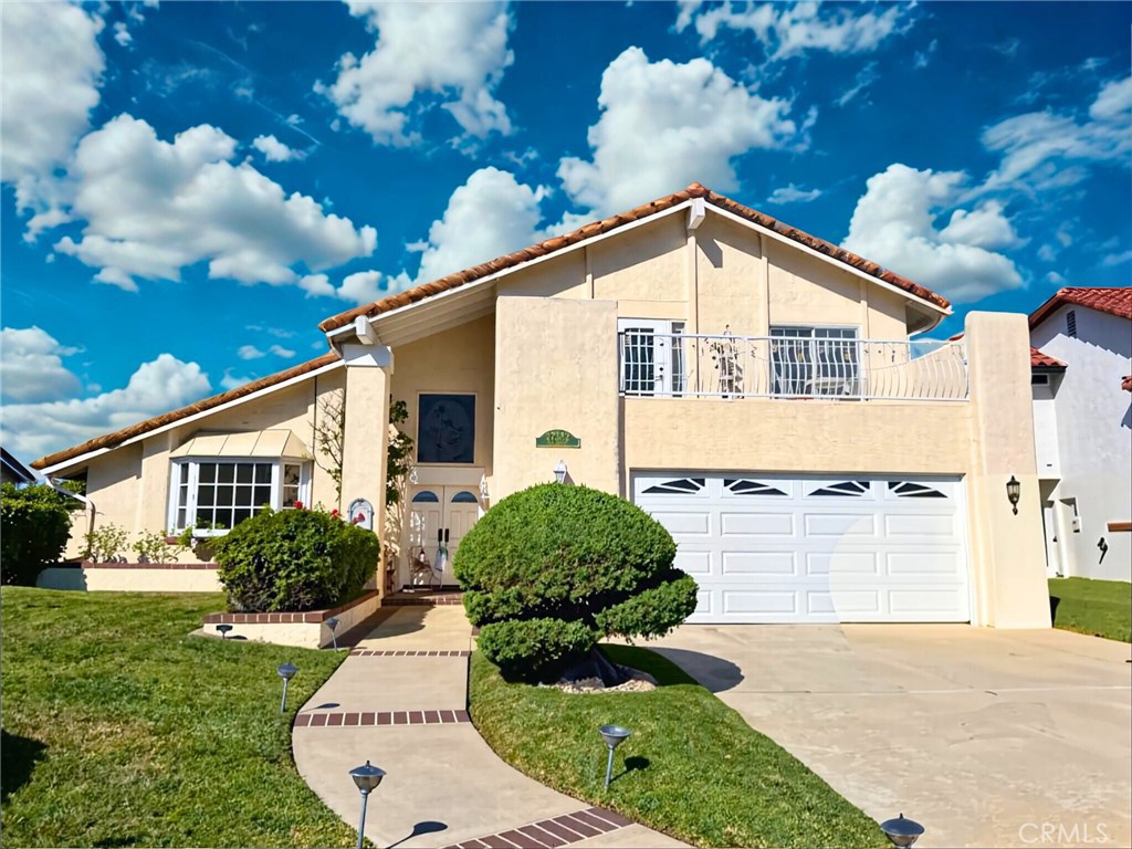 Welcome to this exceptional residence in Mission Viejo’s highly coveted Madrid tract! Tucked away at the end of a peaceful Cul-de-sac, this beautiful home captures sweeping panoramic views and a lifestyle filled with comfort and charm. From the moment you step inside, soaring ceilings and expansive windows fill the interiors with natural light, creating a bright and airy ambiance that feels both spacious and inviting. The updated kitchen features timeless white cabinetry, granite countertops, and plenty of workspace, making it the perfect setting for everyday living and entertaining. A desirable main-level bedroom and full bath provide ideal flexibility for a home office, guest suite, or multi-generational living. Upstairs, the impressive primary suite offers a true retreat with its generous size, breathtaking views, and direct access to a private deck—perfect for morning coffee, evening sunsets, or simply unwinding while soaking in the scenery. Additional bedrooms are well-proportioned, ensuring comfort for family and guests alike. While already well maintained, a fresh coat of paint will allow you to personalize and make this home truly yours. With its prime location in one of Mission Viejo’s most sought-after neighborhoods, access to Lake Mission Viejo, and unmatched views, this rare offering is an opportunity not to be missed. Homes in the Madrid tract are in high demand—come see why this one stands out!