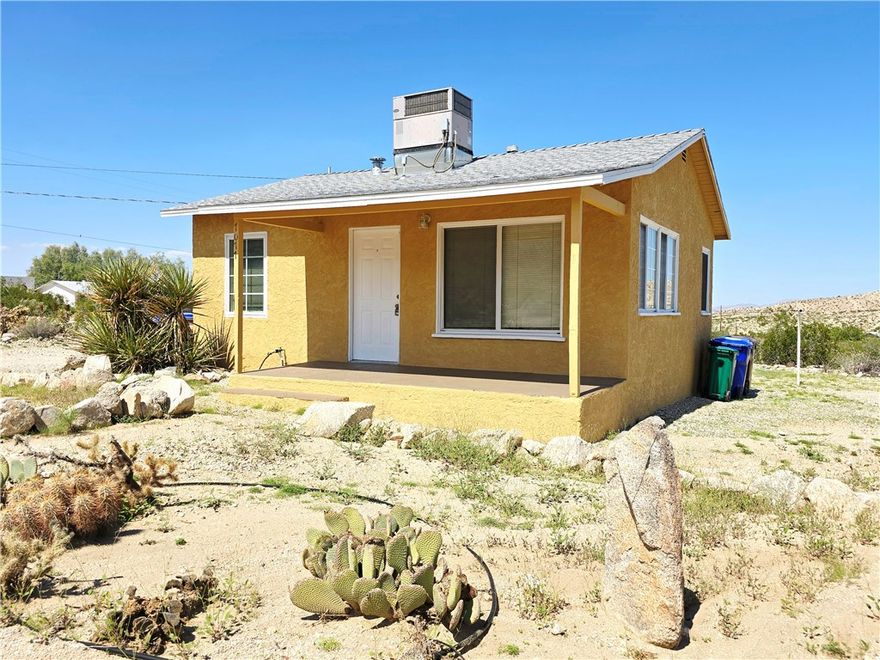 This desert retreat is the perfect escape into nature, offering both tranquility and the beauty of the desert landscape. The seclusion and the proximity to Joshua Tree National Park make it an ideal place for those seeking a peaceful, private environment while still having access to the park's natural wonders. The elevated cabin structure is a smart feature, especially for security and avoiding any runoff during the desert storms whild also providing a nice front deck to relax and unwind after a day of hiking.



With the variety of wildlife, it's not just a retreat, but an opportunity for nature enthusiasts to observe the desert's ecosystem up close—tortoises, quails, and cottontails all sound like fascinating neighbors!  Tucked away at the end of a quiet cul-de-sac, peaceful seclusion is almost a guarantee!  There is a functional kitchen with dishwasher, refridgerator and stackable washer / dryer hookups.  The structure itself has 1 Bedroom, 1 Bathroom, a living area and kitchen with breakfast nook.  Central Heat and AC will help provide the perfect indoor environment.  Dont miss this rare oppurtunity to capture the best that the Desert has to offer!!