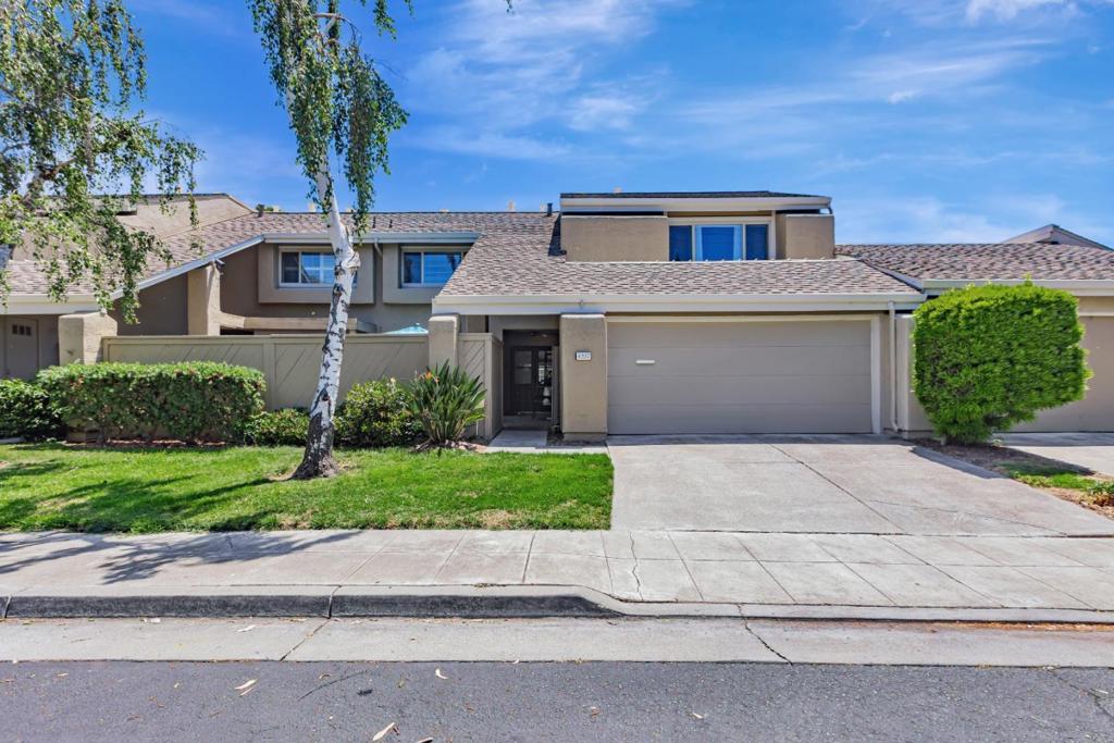 2,122 sq ft, 4 bdr, 2 1/2-ba townhome in the heart of Santa Clara. Enter inside to discover a spacious, sunlit living room to the left with soaring vaulted ceilings, a fireplace, and an open, airy feel that makes the space ideal for entertaining or relaxing at home. To the right is a huge family room. Both the living rm and the family rm have patio doors that lead to the rear yard. The kitchen is both functional and inviting, offering plenty of space to cook, gather, and connect. There are newly installed countertops, backsplash and newly installed appliances. The half bath on the main floor is adjacent to the washer and dryer. 4 bdrs upstairs, including a spacious primary suite with 2 walk in closets, and two beautifully renovated bathrooms featuring modern fixtures and finishes. Outside, enjoy a charming private patio retreat that overlooks the sprawling lake with two waterfalls that provide a peaceful backdrop. This is a patio home as you have access to the garage directly from inside and you have a spacious driveway. The 2 car garage has plenty of storage and there is a plug in for an EV. Low HOA dues, 2 sparkling pools and is minutes from Rivermark Shopping Center, and a variety of tech campuses. Easy access to 101, 237, San Tomas Exp, and Lawrence Exp.