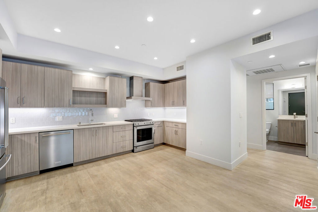 LISTED AT $4,200 /MONTH. NET EFFECTIVE RENT IS APPROXIMATELY $3,675/MONTH BASED ON 6 WEEKS FREE ON A 12-MONTH LEASE (SUBJECT TO APPROVED CREDIT). SECURITY DEPOSIT IS $4,200.) Welcome to 5955 Saturn St #103 a beautiful 2-bedroom, 2-bath unit offering comfort, convenience, and style in one of LA's most central locations. This light-filled residence features a spacious open layout, updated finishes, and modern upgrades throughout. The kitchen comes fully equipped with a stove, refrigerator, dishwasher, and stylish cabinetry, making meal prep and entertaining effortless. Enjoy the ease of in-unit laundry with a stackable washer and dryer, along with central A/C and heat for year-round comfort. Step out onto your large private balcony, perfect for morning coffee, evening wind-downs, or outdoor dining.Both bedrooms are generously sized, offering flexibility for a variety of living arrangements. The unit's clean lines and contemporary design create a warm and inviting atmosphere ideal for anyone looking to enjoy the best of LA living.Situated in a well-maintained building with secure access, this unit puts you just minutes from Beverly Hills, Century City, and an array of dining, shopping, and cultural hotspots.
