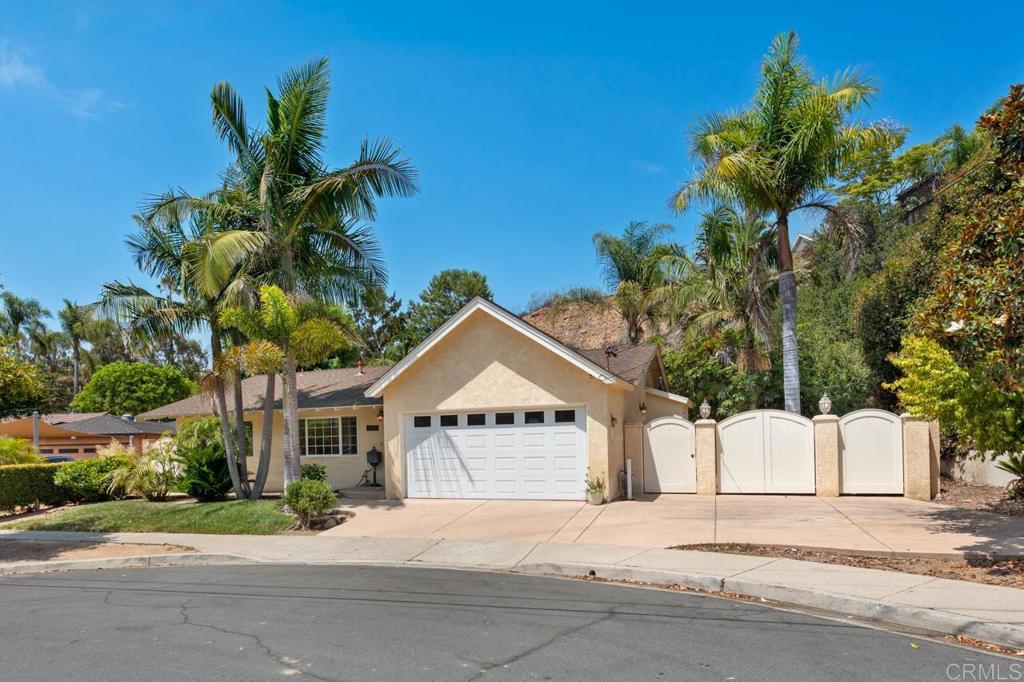 Tucked at the end of a peaceful cul-de-sac-style street in the desirable Linda Vista neighborhood, this beautifully updated 3-bedroom, 2-bathroom home offers a rare opportunity on a generous 22,500 sq ft lot. With a sparkling private pool, mature palms, and terraced hillside landscaping, the backyard feels like your own personal retreat. Inside, enjoy tasteful upgrades throughout including wood-look floors, dual-pane windows, recessed lighting, and modern finishes. The bright, spacious kitchen features warm wood cabinetry, granite countertops, and updated appliances. An oversized window frames serene views of the lush hillside and pool area beyond. Thoughtful floorplan with private bedroom wing, updated bathrooms, and charming curb appeal. Ideal for entertaining, the backyard boasts expansive concrete patio space, a fire pit, and plenty of room for dining al fresco or lounging poolside. Tucked away yet centrally located near Mesa College, USD, and just minutes to shopping, dining, and freeway access. A truly rare find in Clairemont!