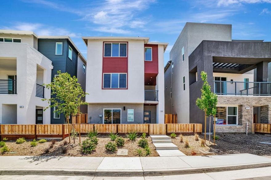 Park location Plan 2 Rows offers 4 bedrooms plus 3.5 bathrooms, featuring a side-by-side garage and a first-floor bedroom perfect for guests. The front entry opens to a charming community park. Its open-concept layout showcases a spacious kitchen with a generous center island, a cozy dining area, and an adjacent office that works as a flexible-use space. A large outdoor deck creates a perfect setting for relaxing or dining al fresco. Interior features include sleek shaker-style paint-grade cabinets and stylish 4" recessed lighting throughout, engineered wood flooring in main living area and front entrance. Solar panels are available through lease or purchase. Home is single-family detached, mapped as condominium. City Village, a new neighborhood from award-winning builder SummerHill Homes, includes 404 well-designed homes in San Ramon. Residents benefit from a 2-acre public park, scenic walking and bike trails, serene seating areas, and a shared BBQ zone. Close to City Walk district and just a mile from lively City Center shops, restaurants, Iron Horse Trail, top schools, transit, and employers. Note: Images shown are of model home. Please visit City Village Sales Office to tour.