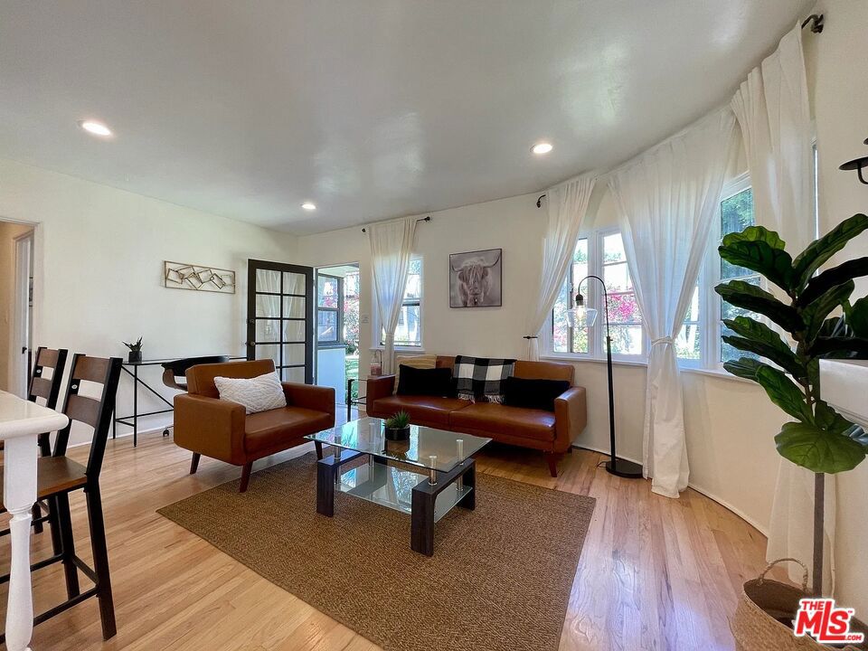 Charming 2Bed/1Bath cottage in 1920s Spanish bungalow court Directly across from Douglas Park Front left bungalow with lots of natural light & only one common wall No one above or below Beautiful white granite countertops & stainless steel appliances, including dishwasher Hardwood floors throughout Tumbled marble bathroom Large closets & lots of storage space Street parking (permit required from the City) Laundry in unit Split system A/C located in living room above faux fireplace Walking distance to all the shops, grocery stores, & restaurants on Wilshire Blvd Front door opens out directly into the grassy courtyard which features a gorgeous antique style fountain, surrounded by bougainvillea and rose bushes Water/sewer/trash included. Tenant responsible for gas & electric. Pet friendly. 1 yr lease.