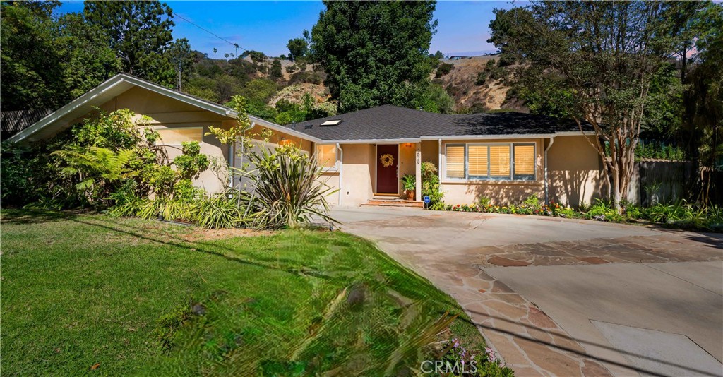 Spectacular location south of Valley Vista beautifully updated single-story ranch-style home, 3 bedrooms, 2 bathrooms, and 2,000 sq ft of living space. Open floor plan amazing, remodeled kitchen, family room, living room indoor outdoor vibe perfect for entertaining Step inside this warm and inviting updated home to find a separate living room accented by a gas and wood-burning fireplace, Hardwood floors run throughout the home, enhanced by recessed lighting and skylights. The heart of the home is the remodeled kitchen featuring stunning quartz countertops, a large center island, and custom soft-close cabinetry and stainless-steel appliances. The kitchen opens seamlessly to the family room, creating the perfect flow for entertaining. From here, enjoy direct indoor-outdoor living with access to a covered patio and hot tub — an ideal space for gatherings. Spacious bedrooms offer comfort and privacy, while both bathrooms have been tastefully updated with stylish modern finishes. Additional highlights include a 2-car garage with EV charging, plantation shutters, and beautifully landscaped front and back yards. The location is unmatched — just minutes from Ventura Blvd’s dining, shops, and nightlife, with easy access to the 101 and 405 freeways. This is more than a home — it’s a rare opportunity to enjoy an updated single-story lifestyle in one of Sherman Oaks’ most coveted south-of-the-boulevard neighborhoods. Don’t miss it!