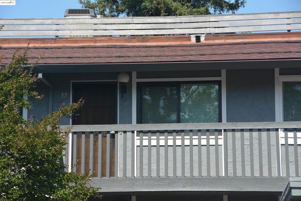 Located on a quiet street near the Pleasant Hill / Walnut Creek border, this upper lever 2 bedroom, 1 bath condo unit features: large living / dining area combo with serving pass through to kitchen * updated kitchen with abundant Mediterranean style cabinetry, black granite counter tops, white appliances and large S/S sink * newer heater, water heater, refrigerator, electric range/oven, microwave, dishwasher and stacked washer/dryer unit * neutral interior décor * central heat & A/C * rear balcony with storage closet * close to Bart, buses, commute access and walking distance from trails, public library, and quaint Poet's Corner area shopping district.