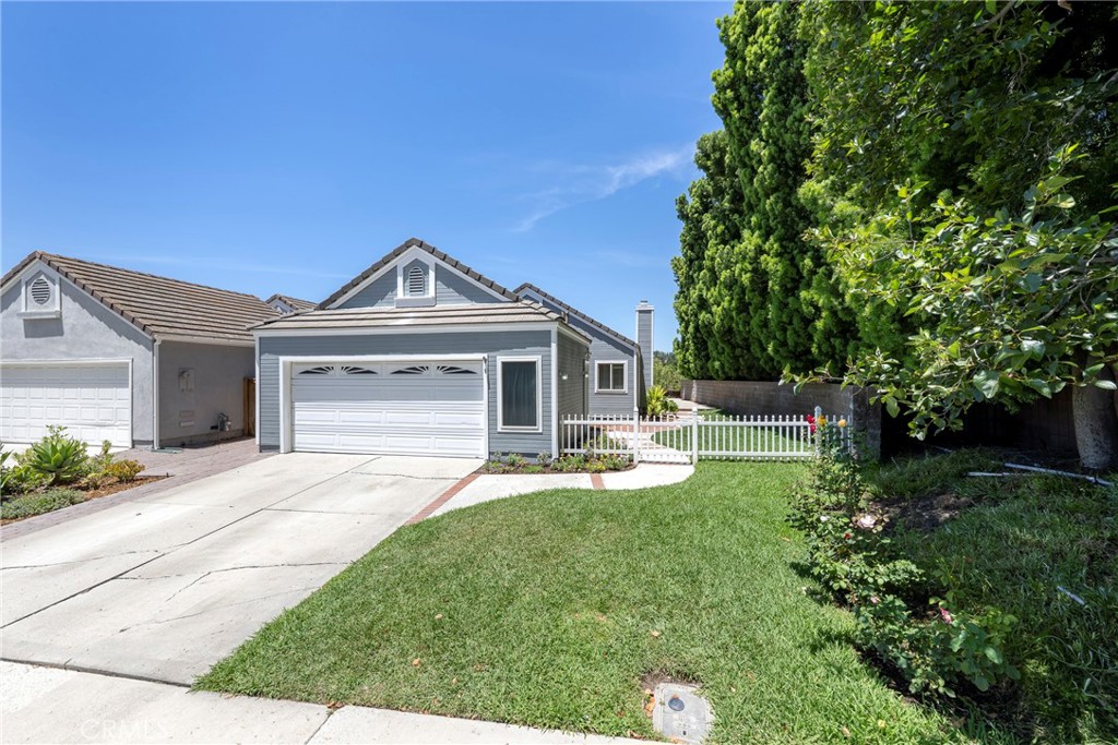 Charming Single-Story Home with Private View Lot. Welcome to this super cute, single-story gem nestled in a quiet, end-of-the-street location. This beautifully updated 3-bedroom, 2-bath home offers comfort, style, and privacy—all in one. Step inside to find newer luxury vinyl flooring throughout and fresh interior paint that gives the space a bright, modern feel. The home is accented with recessed LED lighting with dimmers for the perfect ambiance in every room. Newer dual-pane windows with invisible screens and stunning etched glass sliding doors enhance the natural light and elegance of the living space. The guest bathroom features an oversized tub and shower combo, while the spacious primary suite boasts a Jack and Jill-style closet with ample room for storage. Enjoy the added bonus of a fully insulated and drywalled detached two-car garage, complete with extra storage, a water softener, and a reverse osmosis system. The gated, wraparound yard offers a private outdoor retreat perfect for entertaining, gardening, or simply relaxing and taking in the serene neighborhood views. Don’t miss the opportunity to make this charming, move-in-ready home your own!