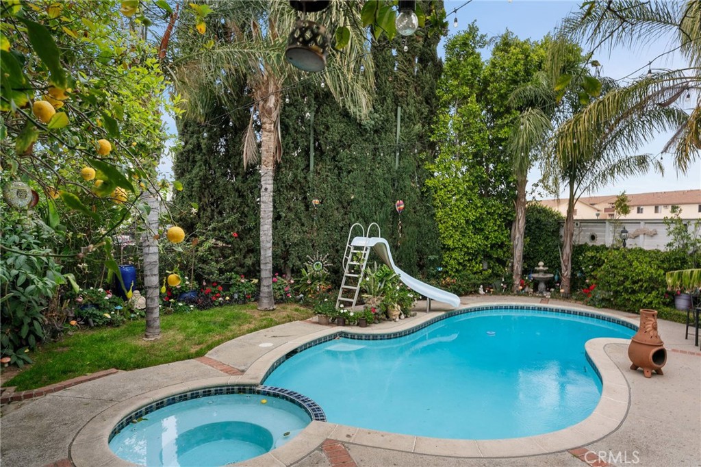 Immaculate Pool Home Overflowing with Charm!
Step into a home that feels like a warm embrace—where timeless character meets modern comfort in perfect harmony. This beautifully maintained 4-bedroom, 3-bathroom multi-level residence welcomes you with sun-filled spaces, graceful design, and an atmosphere that instantly feels like home.
The inviting family room, complete with a built-in wet bar, is made for unforgettable gatherings—whether it’s lively celebrations or quiet evenings with those you love. The thoughtful split-level layout offers both connection and privacy, giving each moment in the home its own special rhythm.
Lovingly cared for and thoughtfully updated—including a complete re-pipe for lasting peace of mind—this residence reflects true pride of ownership. Every detail has been nurtured, leaving it in immaculate, move-in ready condition.
Step outside into your own private paradise: a sparkling pool glistening under the sun, lush greenery wrapping you in serenity, and a lemon tree offering fresh-picked zest to sweeten your days. From sunlit afternoons to starlit evenings, this backyard retreat is designed for joy, relaxation, and lasting memories.
Vacant and ready for immediate occupancy, this home is more than a place to live—it’s a sanctuary of comfort, style, and undeniable charm. All that’s missing is you.