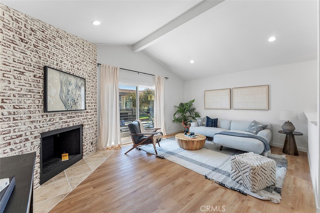 Nestled just east of the vibrant Manhattan Beach and Redondo Beach, this stunningly updated 3-bedroom, 2-bathroom gem is the perfect blend of modern living and coastal charm! Step into a spacious, open-concept upper level where the living room and kitchen effortlessly flow together. Vaulted ceilings, a cozy fireplace, and chic chandelier create an inviting atmosphere, while the sliding doors bathe the space in natural light. The kitchen features sleek quartz countertops, stainless steel appliances, and fresh new shaker cabinets that scream style.
This home has not one, but two balconies—one off the living room and another off the luxurious upstairs primary suite. Speaking of the primary bedroom, enjoy soaring vaulted ceilings and an entire wall dedicated to a generous closet for all your storage needs. Downstairs, you'll discover two more spacious bedrooms and a full bathroom. One of these bedrooms opens directly into your very own private backyard retreat—ideal for relaxing or entertaining, complete with a wooden privacy fence for ultimate seclusion. With an attached 2-car garage and a location that's a dream—convenient to amazing restaurants, grocery stores, and easy freeway access, not to mention just minutes from the beach and premier shopping—this home checks all the boxes. Priced to sell and full of potential, this is one opportunity you won’t want to miss!