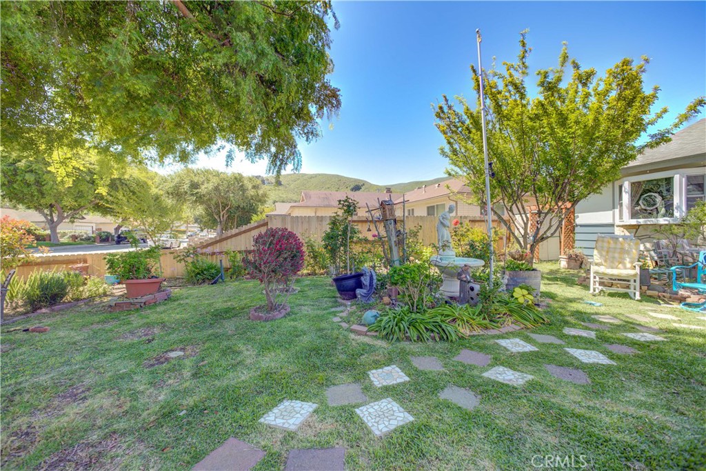 Welcome to 421 South O Place in Lompoc, CA residence that as charming as it is practical. This 4-bedroom, 2-bathroom home spans 1,392 square feet of well-designed space. Step inside to discover a cozy haven, featuring a furnace that's just two years young and a water heater replaced in 2023 ensuring year-round comfort. The living areas flow effortlessly, inviting you to relax or entertain with ease. Outside, the large front yard beckons for barbecues or basking in the sun, all while the newer side fence adds a touch of privacy to your outdoor oasis.
Enhancing the allure of this property, you'll find 9 fruit trees including peach, 2 Granny Smith apple, 2 Santa Rosa plum, Haas avocado, Myers lemon, apricot, and a young tangelo. Enjoy a bountiful garden with blackberries, blueberries, rhubarb, and 2 pomegranates. The extra wide driveway can accommodate an RV, while the yard is completely fenced in for added security. Additional features include 2 storage sheds, French doors leading to a private deck, and a bay window in the primary suite, and a custom garden window in the kitchen. All windows were installed 3-4 years. This home is a smart investment wrapped in a witty package.
Experience it first hand and see the potential that awaits!