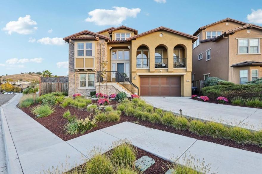 Welcome to an exceptional 5-bed, 4-bath residence built in 2019 by Lafferty Communities, offering 3,300+ sqft of luxurious living space. Perfectly situated at the end of a quiet cul-de-sac, this Northwest-facing home sits on one of the most desirable lots in the community, featuring unobstructed views & an elevated sense of privacy. Step inside to find soaring ceilings, expansive windows, & a bright open floor plan that blends modern design w/timeless comfort. The chefs kitchen features a grand quartz-topped island, premium Bertazzoni appliances, & ample cabinetry ideal for the inspired home chef. The great room seamlessly connects to the kitchen & dining areas, creating an effortless flow for both entertaining & everyday living. Upstairs, the primary suite is a peaceful retreat w/breathtaking mountain views, his & her walk-in closets, dual vanities, a spa-like soaking tub, & a modern glass-enclosed shower. Additional beds are conveniently located on the main level, offering flexibility for guests & family. The backyard features custom hardscaping, lush landscaping, & multiple seating areas perfect for al fresco dining or relaxing under the stars. Additional highlights include brand-new carpet, a finished two-car garage, & the assurance of a newer, meticulously maintained home.